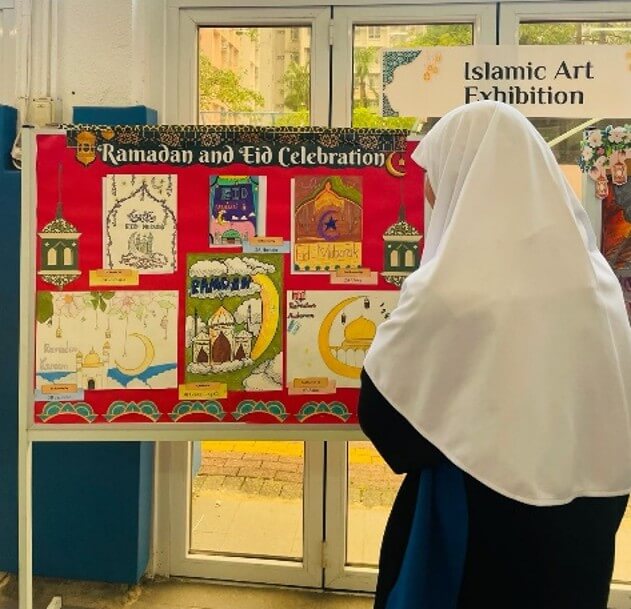 Student viewing the Islamic Art Exhibition display board