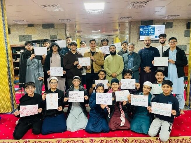 Students engaging in Islamic Trivia using digital tablets